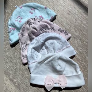 Various sizes from NB, 3mth, and 9 mth hats. Different brands, including Kissy.